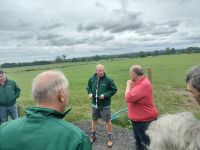 Dairy farmer Pat Walsh talking to David Ackland and the Devon Grassland Society group